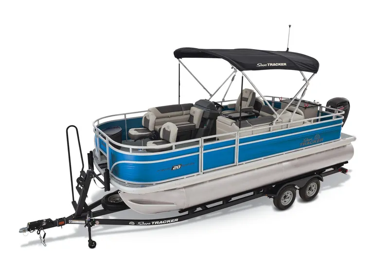 Slide: The Image of 2026 Sun Tracker Fishin' Barge 20 DLX pontoon boat on display outdoors. - 4