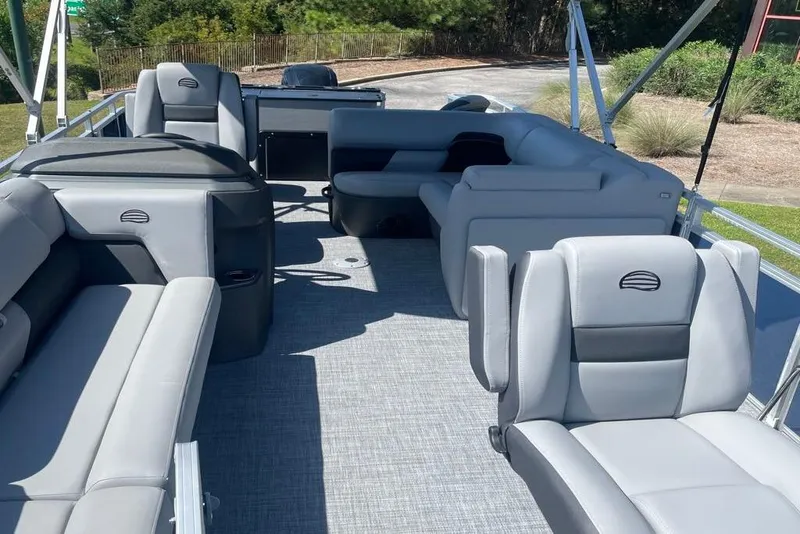 Slide: The Image of 2026 Sun Tracker SportFish 20 DLX pontoon boat with spacious seating and modern design. - 3