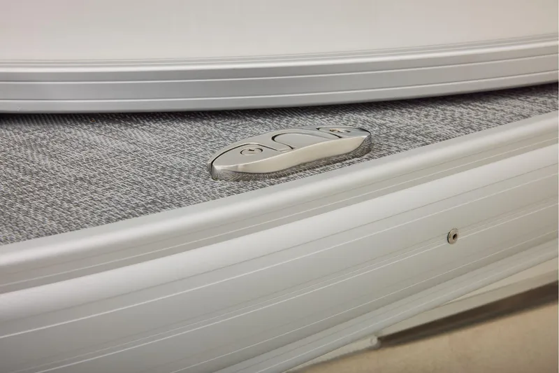 Slide: The Image of Sun Tracker Party Barge 20 DLX 2026, battery compartment under gray seating. - 20