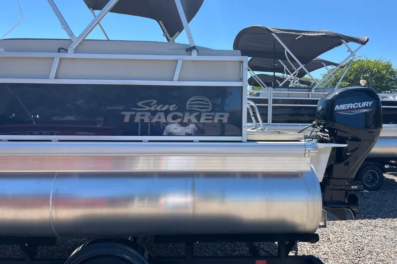 Slide: The Image of 2026 Sun Tracker Bass Buggy 16 XL Select pontoon boat with Mercury outboard motor. - 4