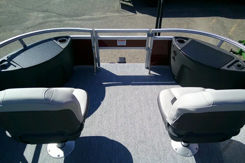 Slide: The Image of 2026 Sun Tracker Bass Buggy 18 DLX pontoon boat interior with seating and storage. - 10