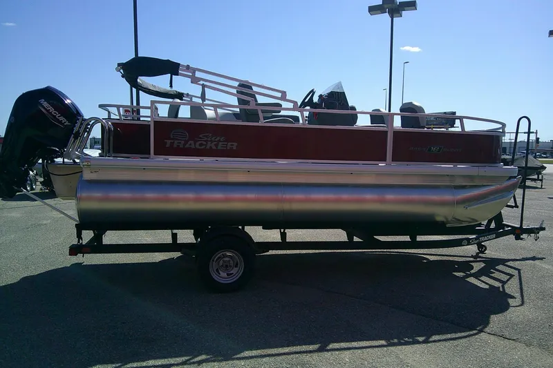 Slide: The Image of 2026 Sun Tracker Bass Buggy 18 DLX pontoon boat on trailer, side view. - 5
