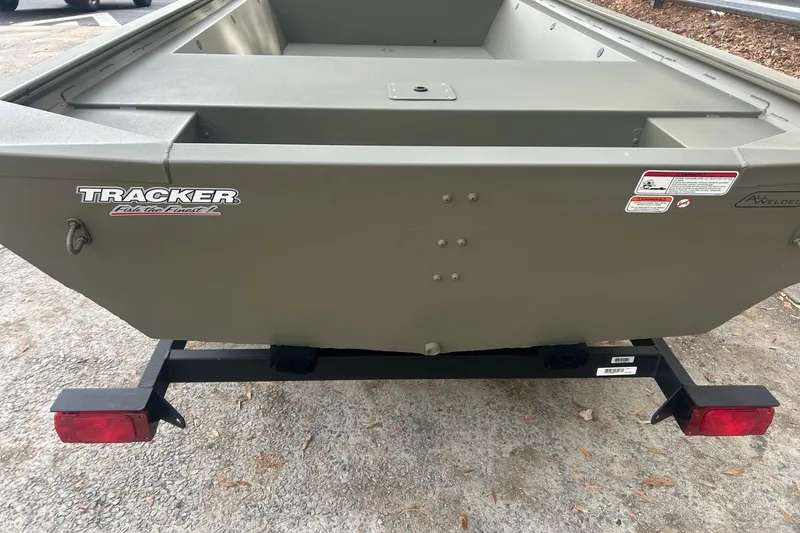 Slide: The Image of 2026 Tracker Grizzly 1648 Utility boat on trailer, rear view, olive green color. - 5