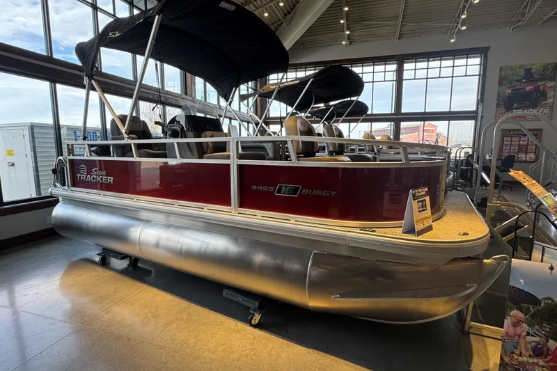 The Image of 2026 Sun Tracker Bass Buggy 16 XL Select pontoon boat displayed indoors. - 69
