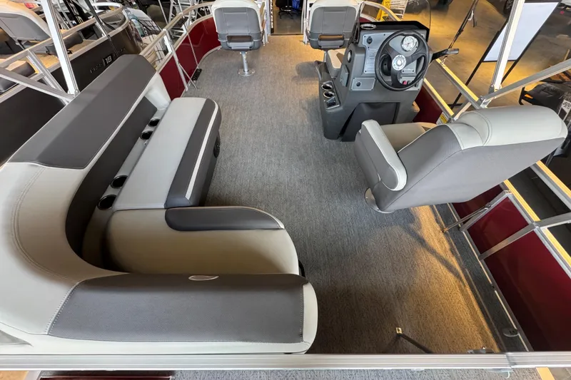 Slide: The Image of 2026 Sun Tracker Bass Buggy 16 XL Select interior with seating and steering console. - 72