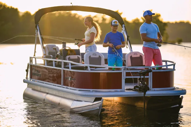 Slide: The Image of 2026 Sun Tracker Bass Buggy 16 XL Select pontoon boat with people fishing at sunset. - 73