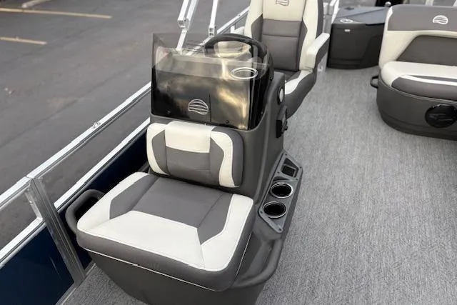 Slide: The Image of 2026 Sun Tracker Bass Buggy 18 DLX interior with gray and white seating and cup holders. - 12
