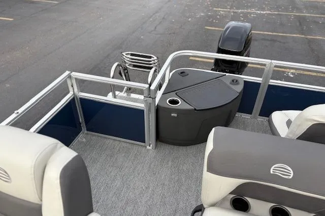 Slide: The Image of 2026 Sun Tracker Bass Buggy 18 DLX pontoon boat interior with seating and motor. - 17