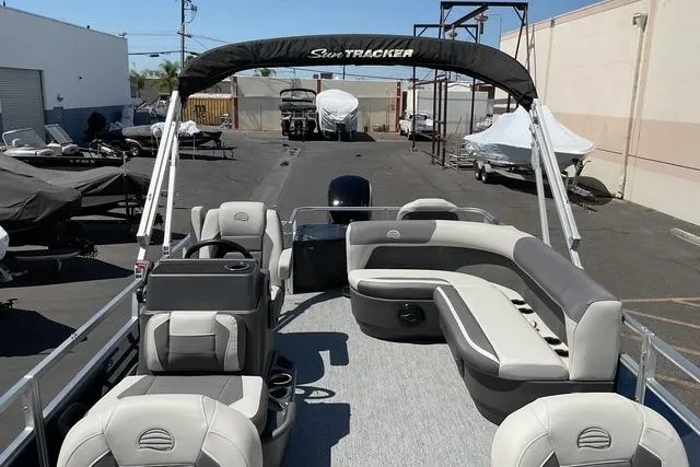 Slide: The Image of 2026 Sun Tracker Bass Buggy 18 DLX pontoon boat with spacious seating and canopy. - 18