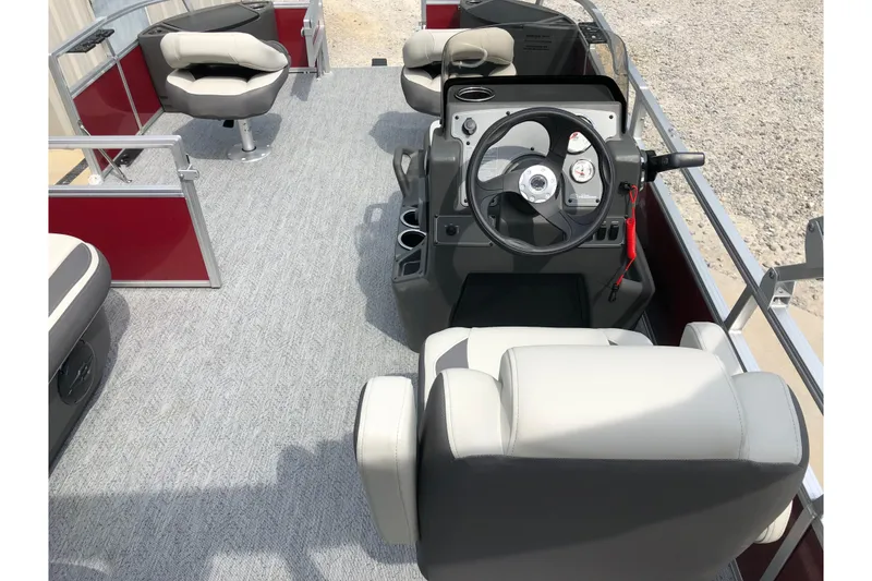 Slide: The Image of 2026 Sun Tracker Bass Buggy 18 DLX boat interior with swivel seat and cup holders. - 12