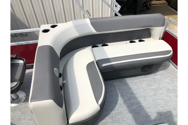 Slide: The Image of 2026 Sun Tracker Bass Buggy 18 DLX interior with steering console and seating. - 13