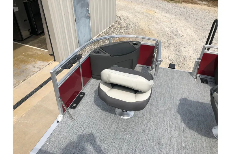 Slide: The Image of 2026 Sun Tracker Bass Buggy 18 DLX pontoon boat seating with cup holders. - 14