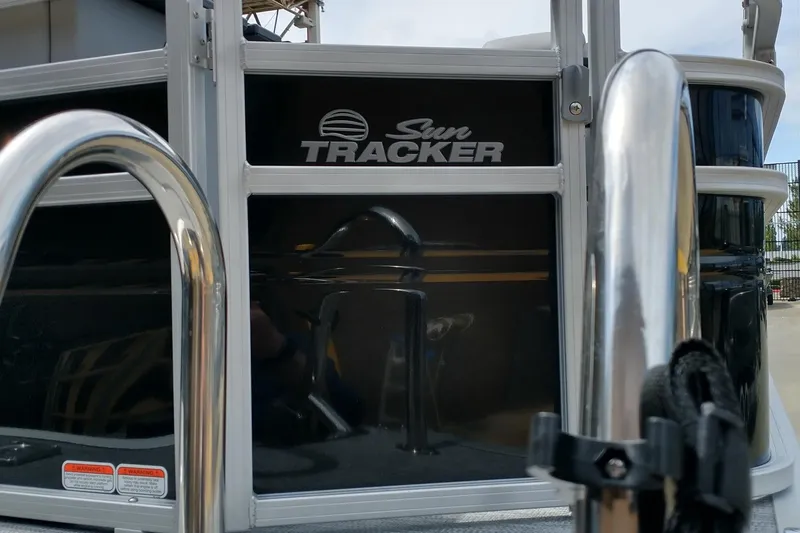 Slide: The Image of 2026 Sun Tracker SportFish 20 DLX pontoon boat with plush seating and modern design. - 14