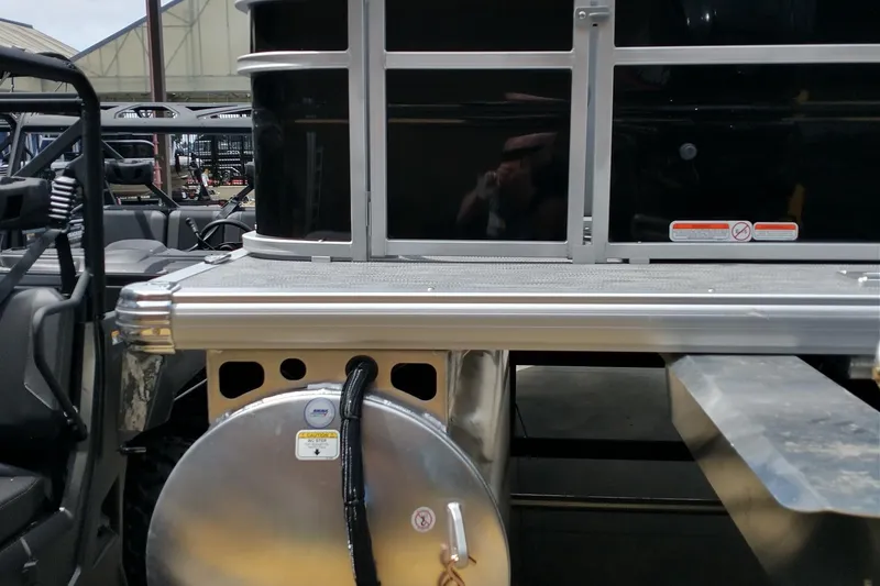 Slide: The Image of 2026 Sun Tracker SportFish 20 DLX pontoon boat with sleek black exterior and chrome details. - 15