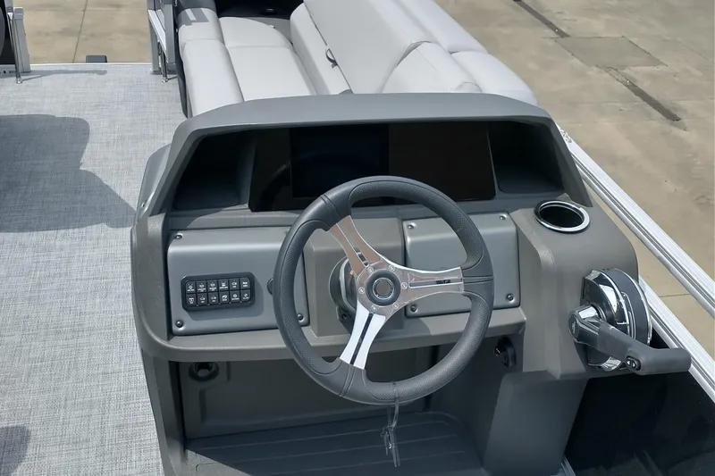 Slide: The Image of 2026 Sun Tracker SportFish 20 DLX pontoon boat with Mercury engine on trailer. - 4