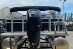 Slide: The Image of 2026 Sun Tracker SportFish 20 DLX boat dashboard with steering wheel and controls. - 5