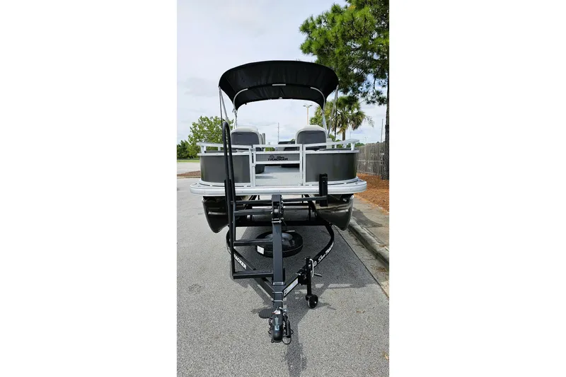 Slide: The Image of 2026 Sun Tracker Bass Buggy 18 DLX interior with steering console and comfortable seating. - 5