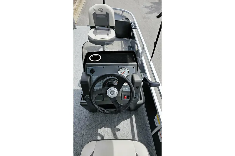 Slide: The Image of 2026 Sun Tracker Bass Buggy 18 DLX boat interior with seating and control panel. - 8