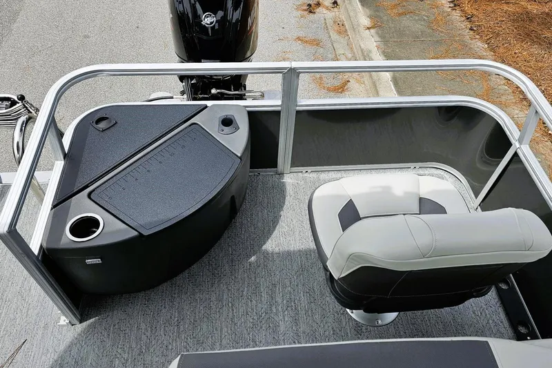 Slide: The Image of 2026 Sun Tracker Bass Buggy 18 DLX boat seats, featuring gray and white upholstery. - 9