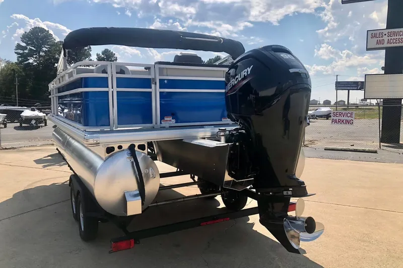 Slide: The Image of 2026 Sun Tracker Fishin' Barge 20 DLX pontoon boat with Mercury outboard motor. - 3