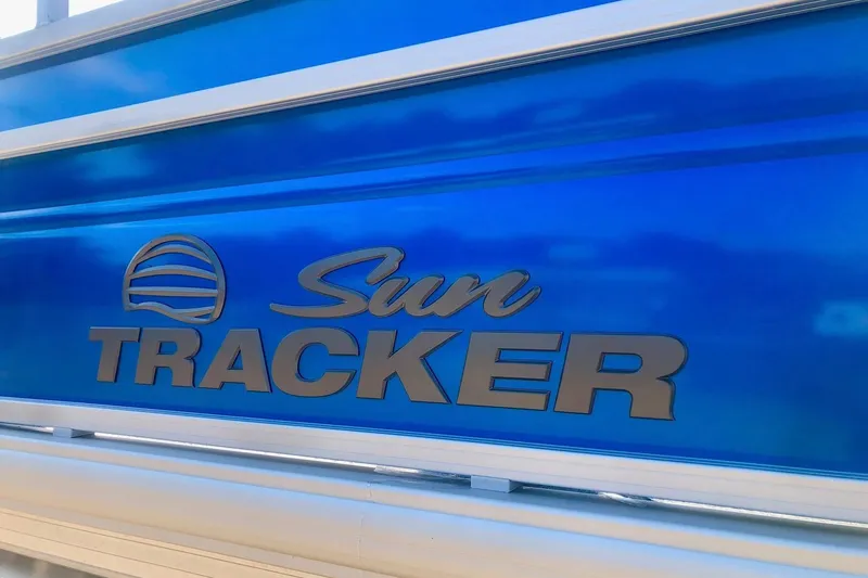Slide: The Image of 2026 Sun Tracker Fishin' Barge 20 DLX logo on blue background. - 4