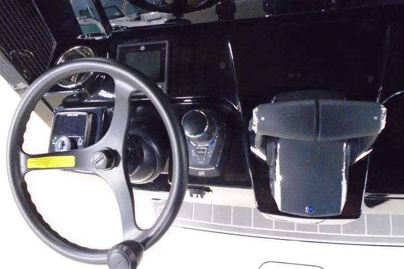 Slide: The Image of Steering console of 2026 Scout 288 LXF boat with modern controls and displays. - 16