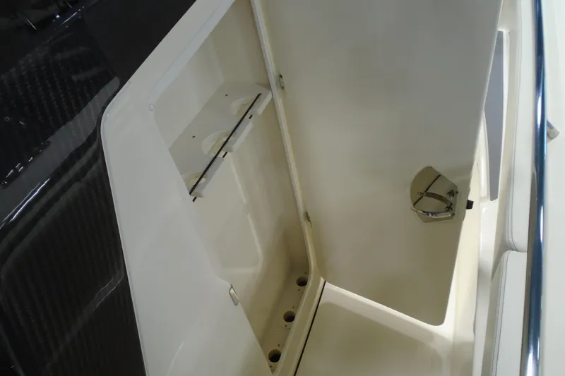 Slide: The Image of Open storage compartment on 2026 Scout 288 LXF boat, showcasing interior space. - 21