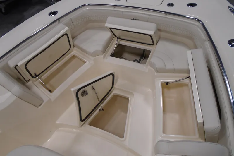 Slide: The Image of 2026 Scout 288 LXF boat interior with open storage compartments and seating. - 25
