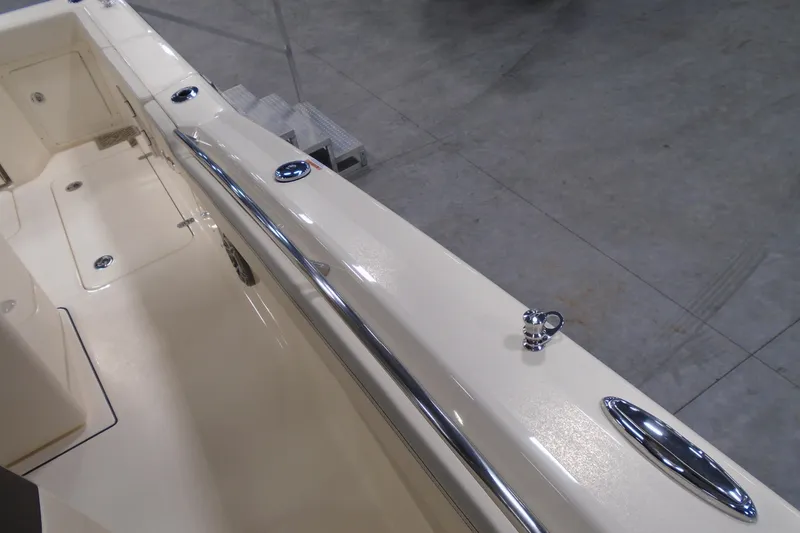 Slide: The Image of 2026 Scout 288 LXF boat interior with sleek chrome fittings and spacious deck. - 28