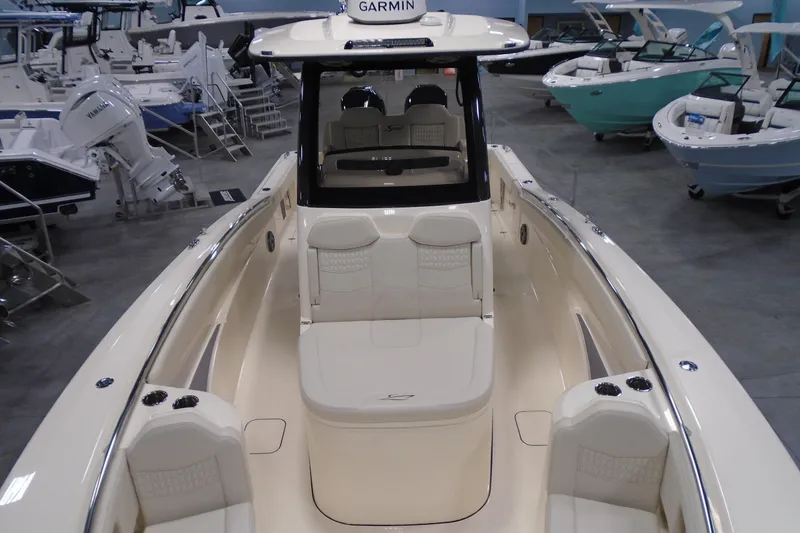 Slide: The Image of 2026 Scout 288 LXF boat interior with luxurious seating and Garmin navigation system. - 29