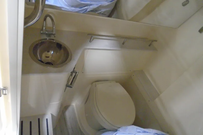 Slide: The Image of 2026 Scout 288 LXF boat bathroom with sink and toilet. - 33