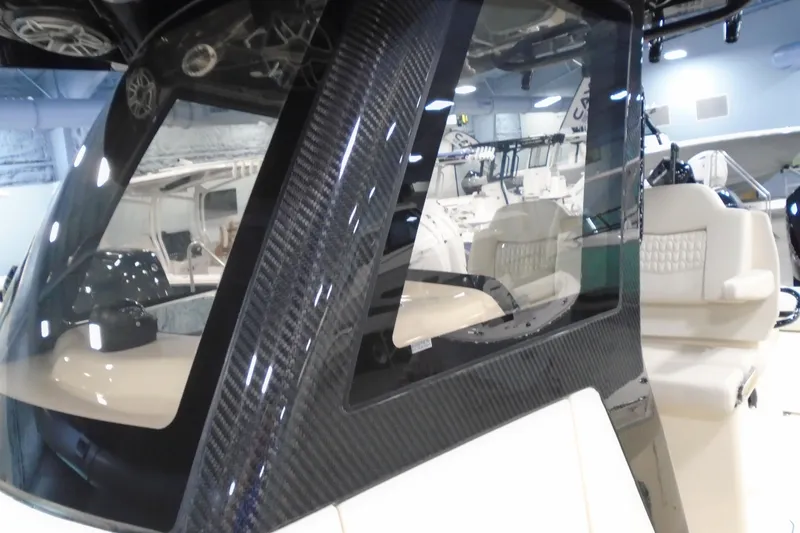 Slide: The Image of 2026 Scout 288 LXF boat interior with sleek carbon fiber detailing. - 35