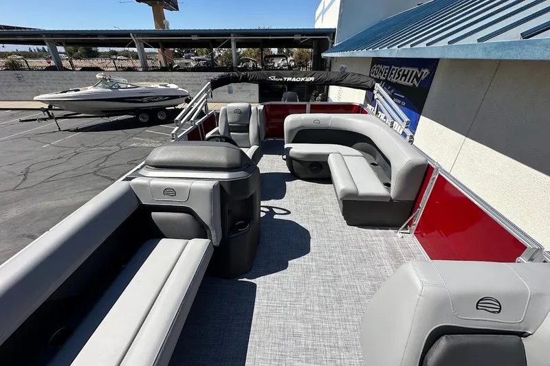 Slide: The Image of 2026 Sun Tracker Party Barge 18 DLX pontoon boat with spacious seating and modern design. - 10