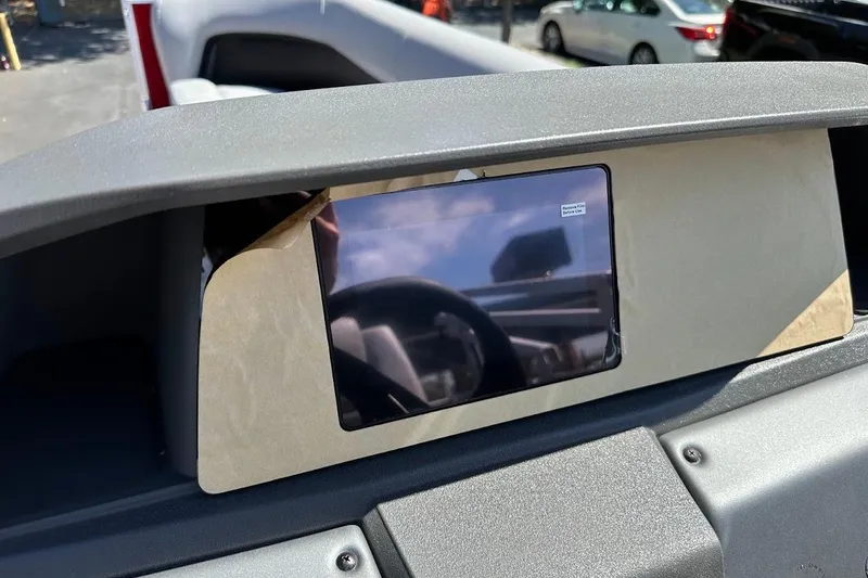 Slide: The Image of Dashboard of 2026 Sun Tracker Party Barge 18 DLX with protective screen cover. - 21