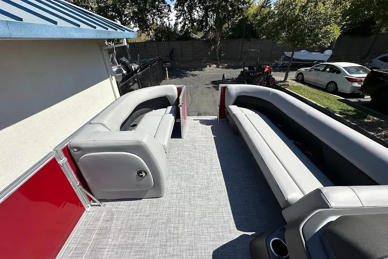 Slide: The Image of 2026 Sun Tracker Party Barge 18 DLX interior with spacious seating and modern design. - 23