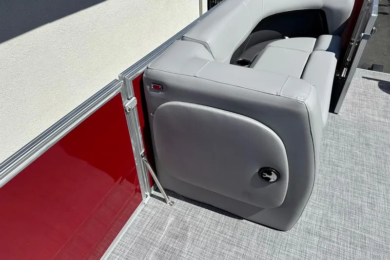 Slide: The Image of 2026 Sun Tracker Party Barge 18 DLX with gray seating and red paneling. - 24