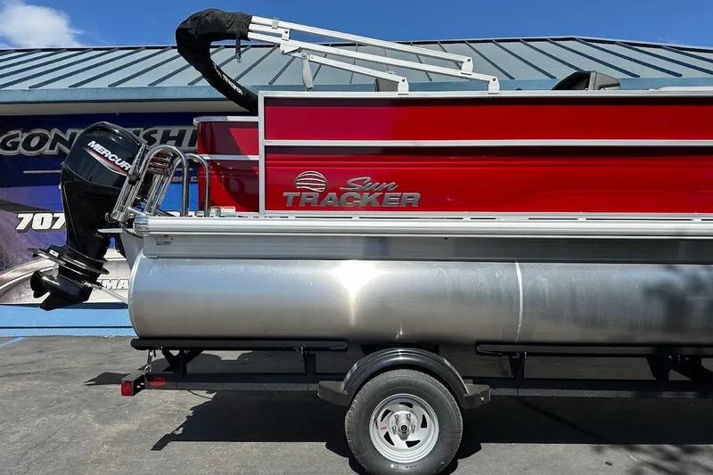 Slide: The Image of 2026 Sun Tracker Party Barge 18 DLX pontoon boat with Mercury outboard motor. - 6