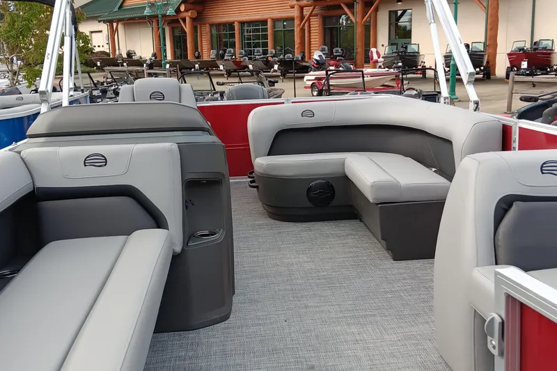 Slide: The Image of 2026 Sun Tracker Party Barge 18 DLX interior with gray seating and spacious layout. - 3