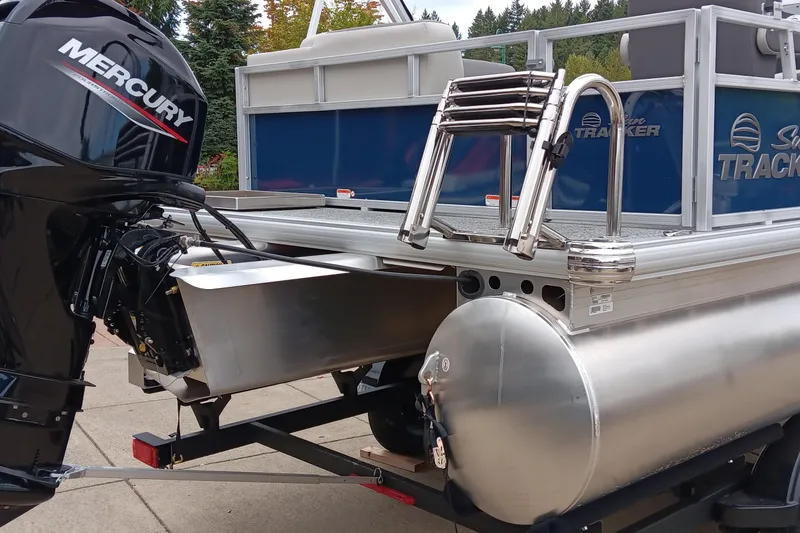 Slide: The Image of 2026 Sun Tracker Bass Buggy 16 XL Select pontoon boat with Mercury outboard motor. - 4