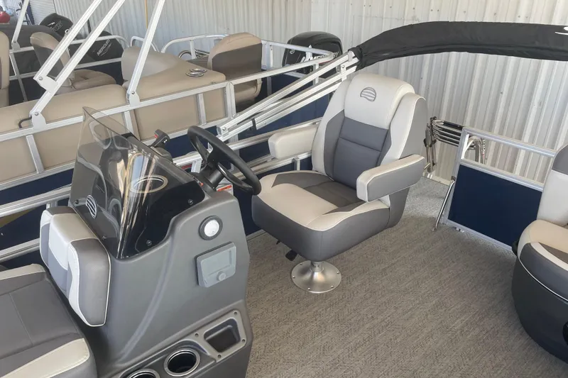 Slide: The Image of 2026 Sun Tracker Bass Buggy 16 XL Select interior with captain's chair and steering console. - 6