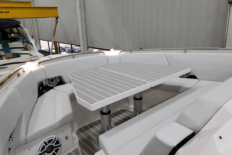 Slide: The Image of 2026 Formula 500 Super Sport Crossover boat interior with sleek seating and table. - 19