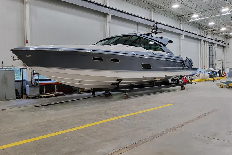 Slide: The Image of 2026 Formula 500 Super Sport Crossover yacht in a spacious indoor facility. - 2