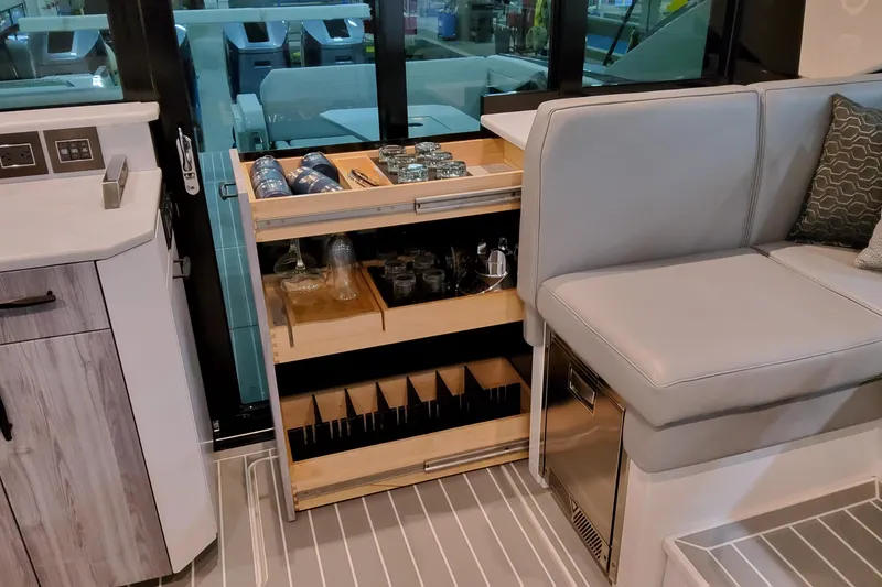 Slide: The Image of 2026 Formula 500 Super Sport Crossover interior with bar storage and seating area. - 29