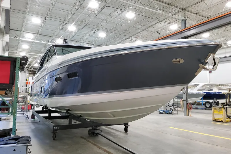 Slide: The Image of 2026 Formula 500 Super Sport Crossover boat in a manufacturing facility. - 3