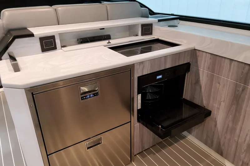 Slide: The Image of 2026 Formula 500 Super Sport Crossover kitchen with modern appliances and sleek design. - 34
