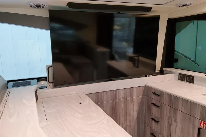 Slide: The Image of Interior of 2026 Formula 500 Super Sport Crossover with modern cabinetry and large TV screen. - 35