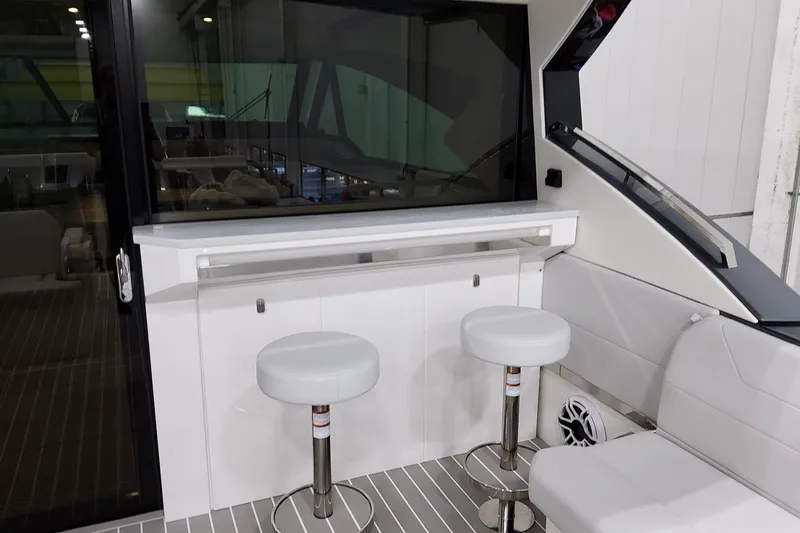 Slide: The Image of 2026 Formula 500 Super Sport Crossover interior with bar stools and sleek design. - 37