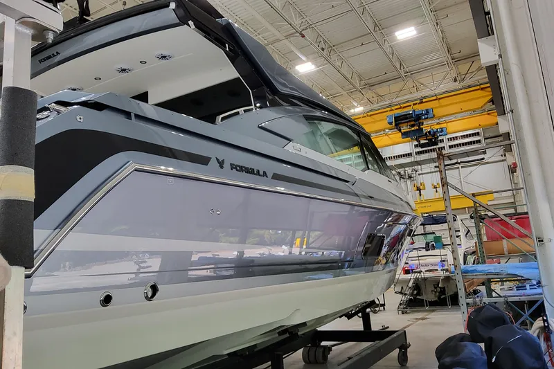 Slide: The Image of 2026 Formula 500 Super Sport Crossover boat in a manufacturing facility. - 4