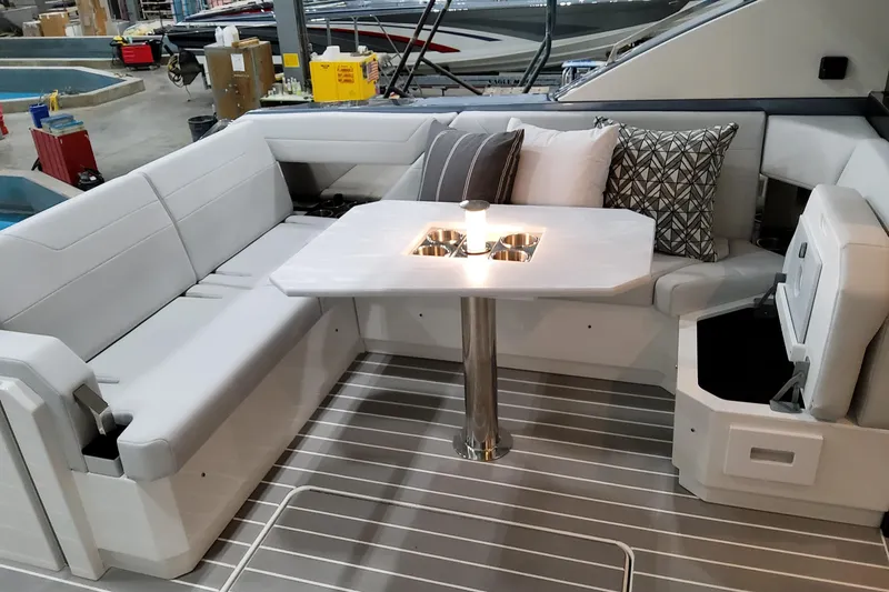 Slide: The Image of Luxurious seating area on 2026 Formula 500 Super Sport Crossover yacht, featuring elegant cushions and table. - 40