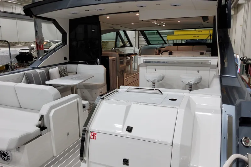 Slide: The Image of 2026 Formula 500 Super Sport Crossover luxury yacht interior with seating and dining area. - 41